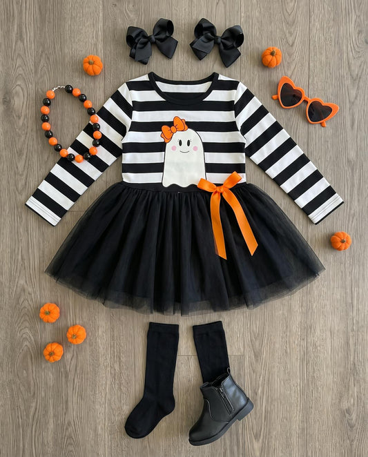 Girls striped ghost tutu dress laid flat with a bow, boots and mini pumpkins